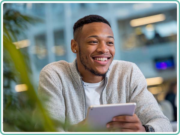 Male Influencer Using Tablet